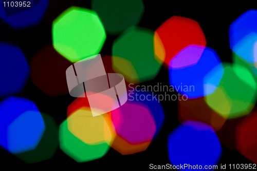 Image of Blurred holiday colorful lights over black