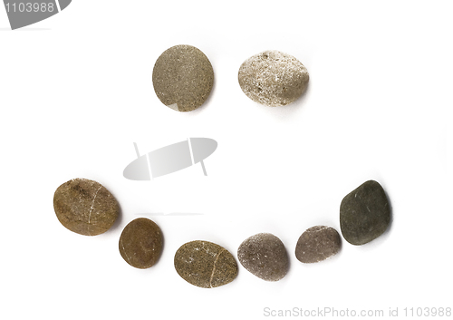 Image of Positive funny emoticon assembled of pebble