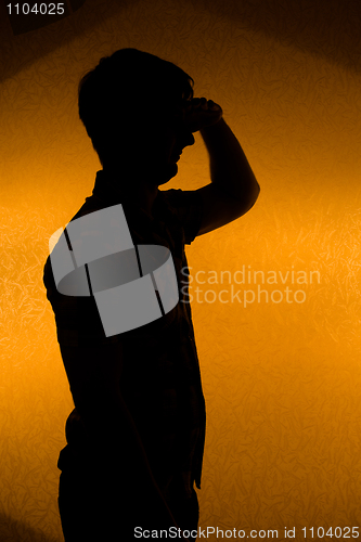 Image of Looking forward. Back lit silhouette of confident man