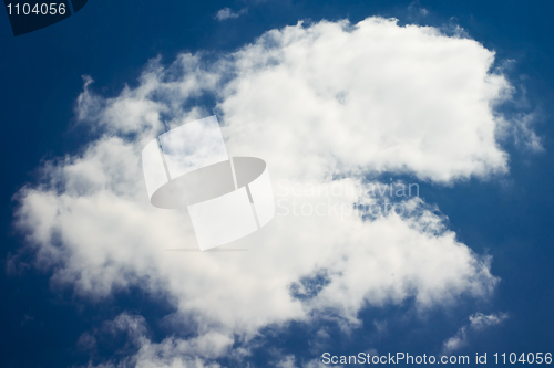 Image of Single cloud in the blue sky