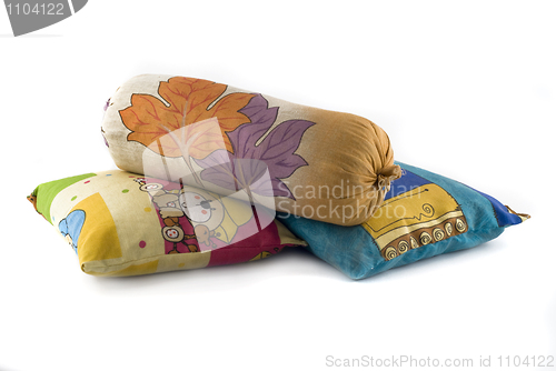 Image of Pile of three colorful pillows