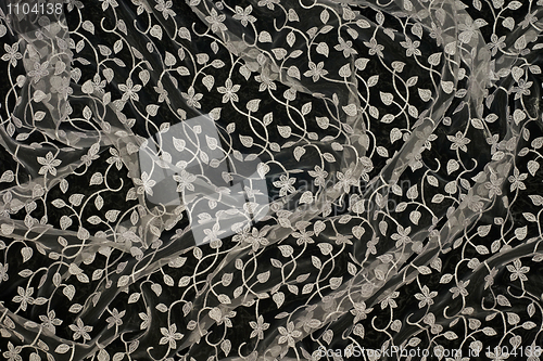 Image of Beautiful lacy fabric on black