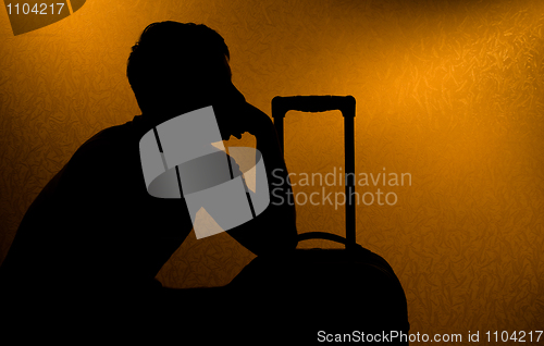 Image of Traveling - silhouette of man and suitcase