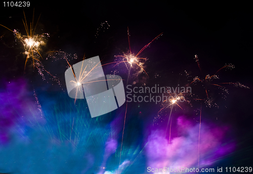 Image of Fireworks in the lilac and blue smoke 