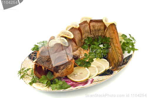 Image of Bloated fresh-water catfish (sheatfish) with lemon