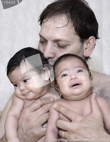 Image of father and baby twins