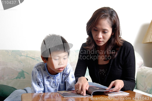 Image of Mom reading with son