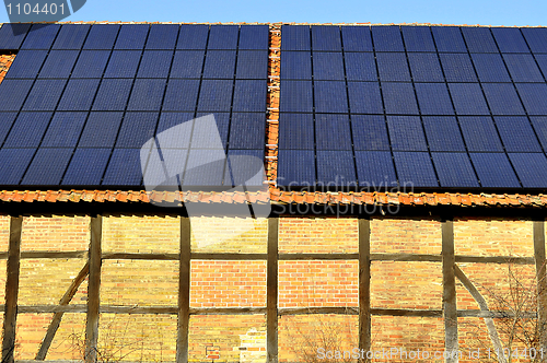 Image of Solar panels on a roof of a rural shed in Germany