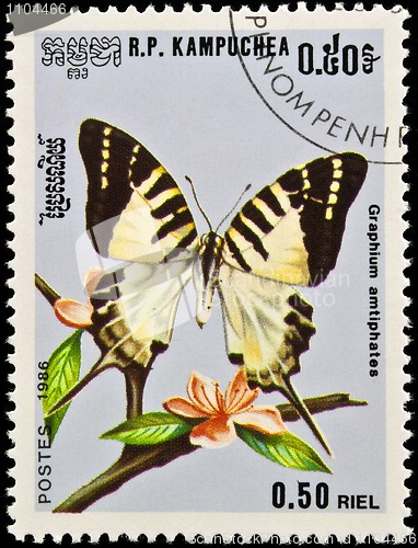 Image of Stamp, butterfly and flower.