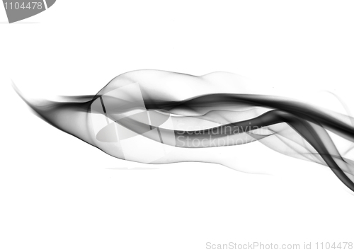 Image of Black smoke waves over white 