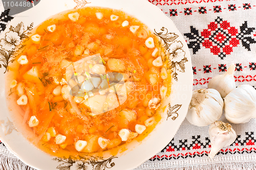 Image of In the restaurant - borsch and garlic heads