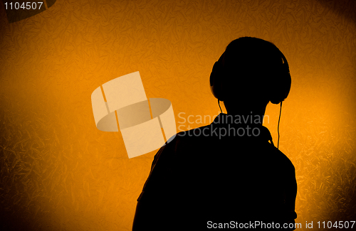 Image of DJ with earphones 