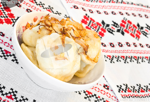 Image of Ukrainian vareniki or dumplings with fried onion