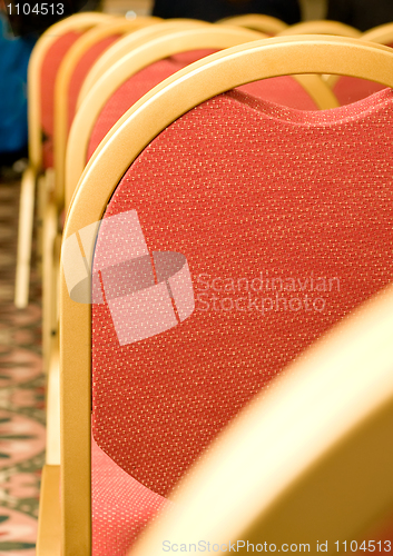 Image of Meeting. Closeup of red Chair back