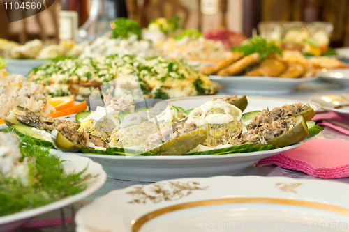 Image of Banquet in the restaurant. Stuffed eggs and cucumbers