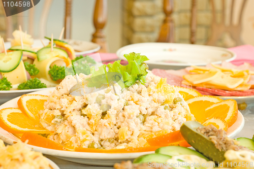 Image of Salad with orange slices. Banquet in the restaurant