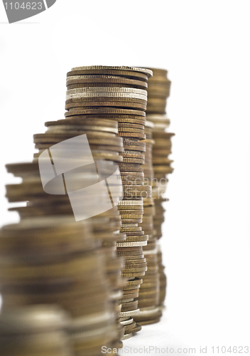 Image of Towers assembled of coins. Slump or growth