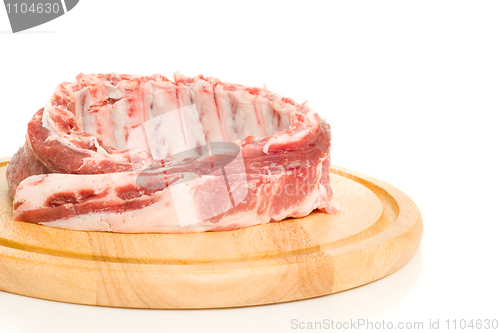 Image of Tasty Pork ribs on round hardboard