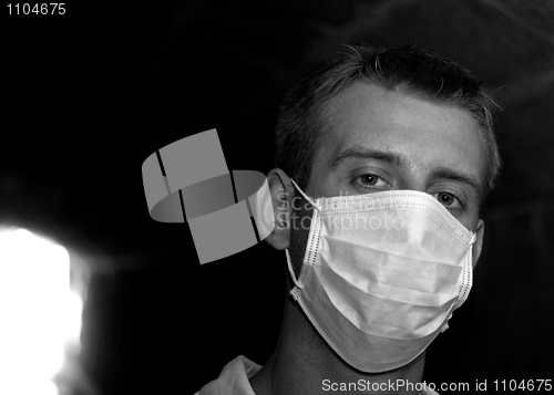 Image of Man with gauze bandage in dark tunnel