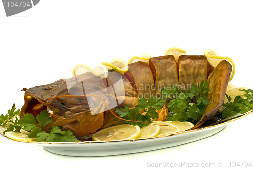 Image of Tasty dinner - bloated fresh-water catfish on the plate