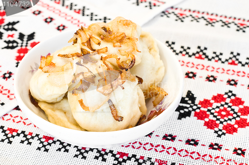 Image of Ukrainian vareniki or dumplings with fried onion
