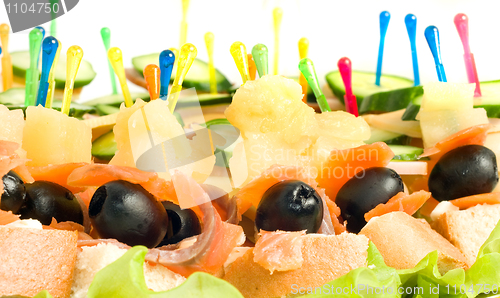 Image of Close-up of canape with olives, cheese and mushrooms