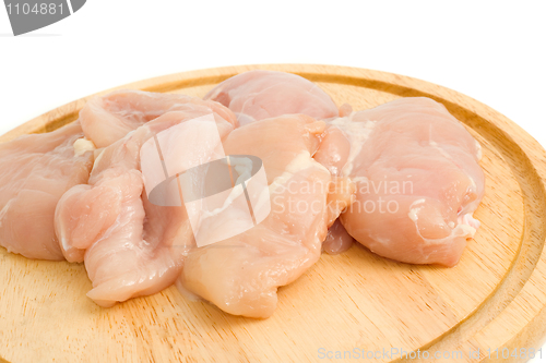 Image of Close-up of Chicken fillet on hardboard isolated 