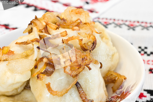 Image of Ukrainian cuisine - vareniki (dumplings) with fried onion