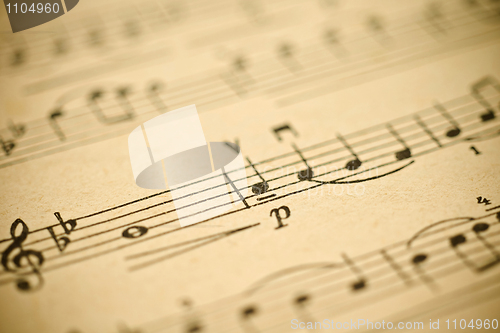 Image of Classical music - notes on yellowed vintage paper sheet 