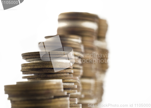 Image of Growth - towers assembled of coins shallow DOF 