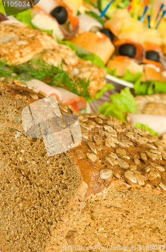 Image of Cut Bread with seeds, meat and canape 