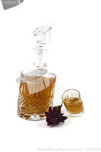 Image of Crystal decanter with jigger and flower for alcoholic beverage