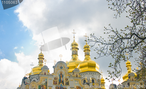 Image of  Laura in spring. Golden domes over cloudy sky