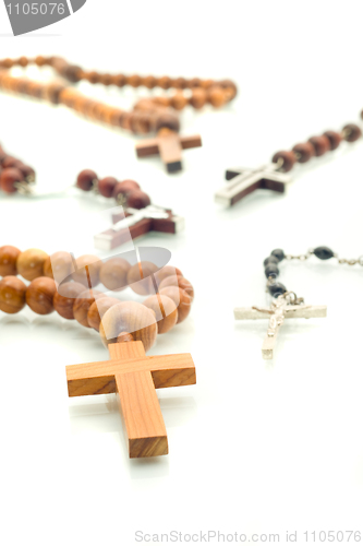 Image of Religion diversity - rosary beads over white