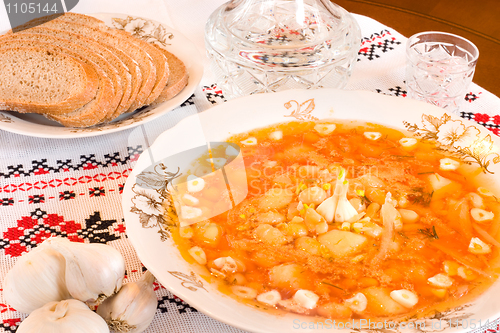 Image of Ukrainian food - borsch, vodka, bread