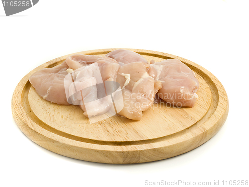 Image of Raw Chicken fillet on hardboard