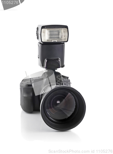 Image of Professional DSLR camera with telephoto lens and flash