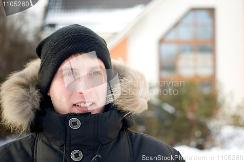 Image of Winter - happy man in cap and warm jacket