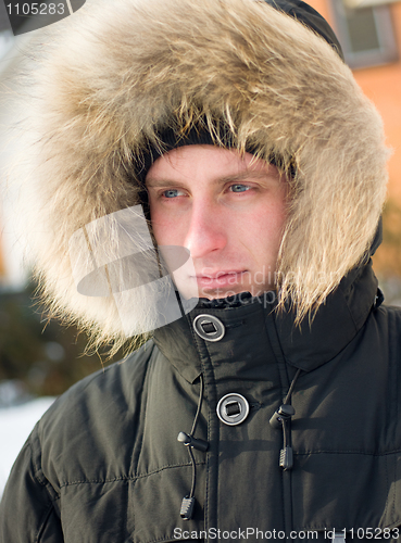 Image of Winter - man in warm jacket with furry hood