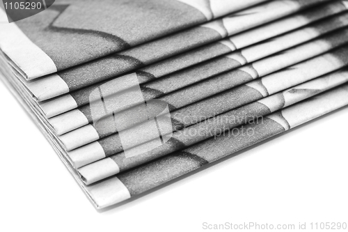 Image of Heap of daily paper or newspapers over white 