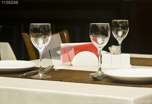 Image of In the restaurant - wineglasses and table appointments