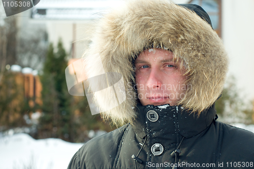 Image of Winter - man in warm jacket with furry hood