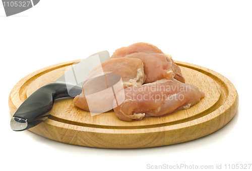 Image of Chicken fillet and knife on hardboard