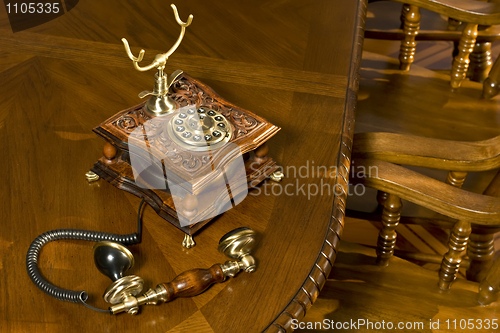 Image of Old-fashioned telephone on table