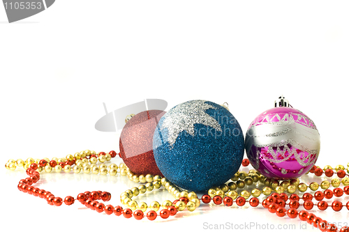 Image of Christmas greeting - red, blue and pink balls 
