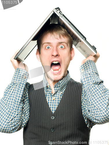 Image of Shocked man with laptop over his head 