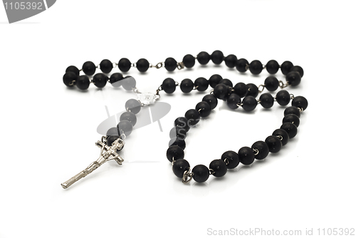 Image of Beads isolated over white with focus on cross