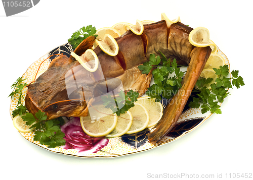 Image of Bloated sheatfish with lemon and parsley