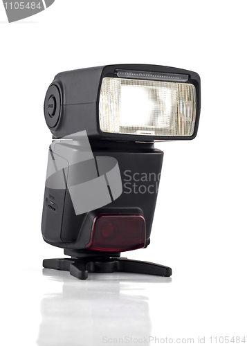 Image of Professional flash on stand for digital camera isolated