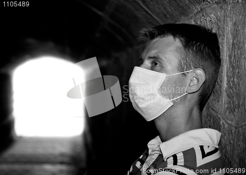 Image of Male with Gauze bandage in dark tunnel 